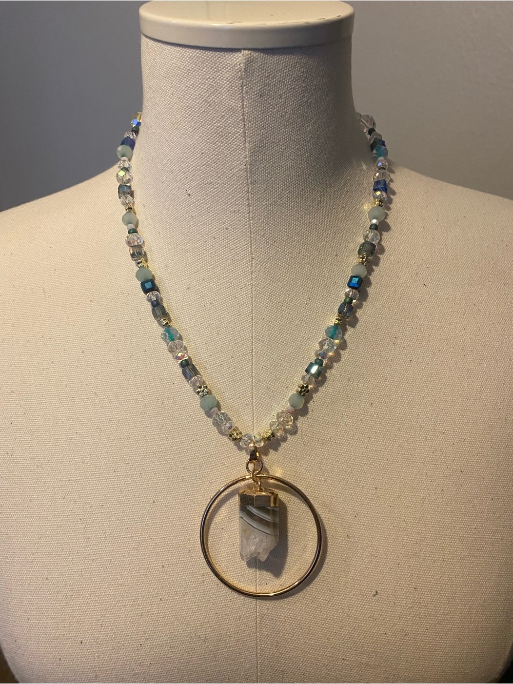 Blue beaded necklace with gold hoop and crystal pendant handmade